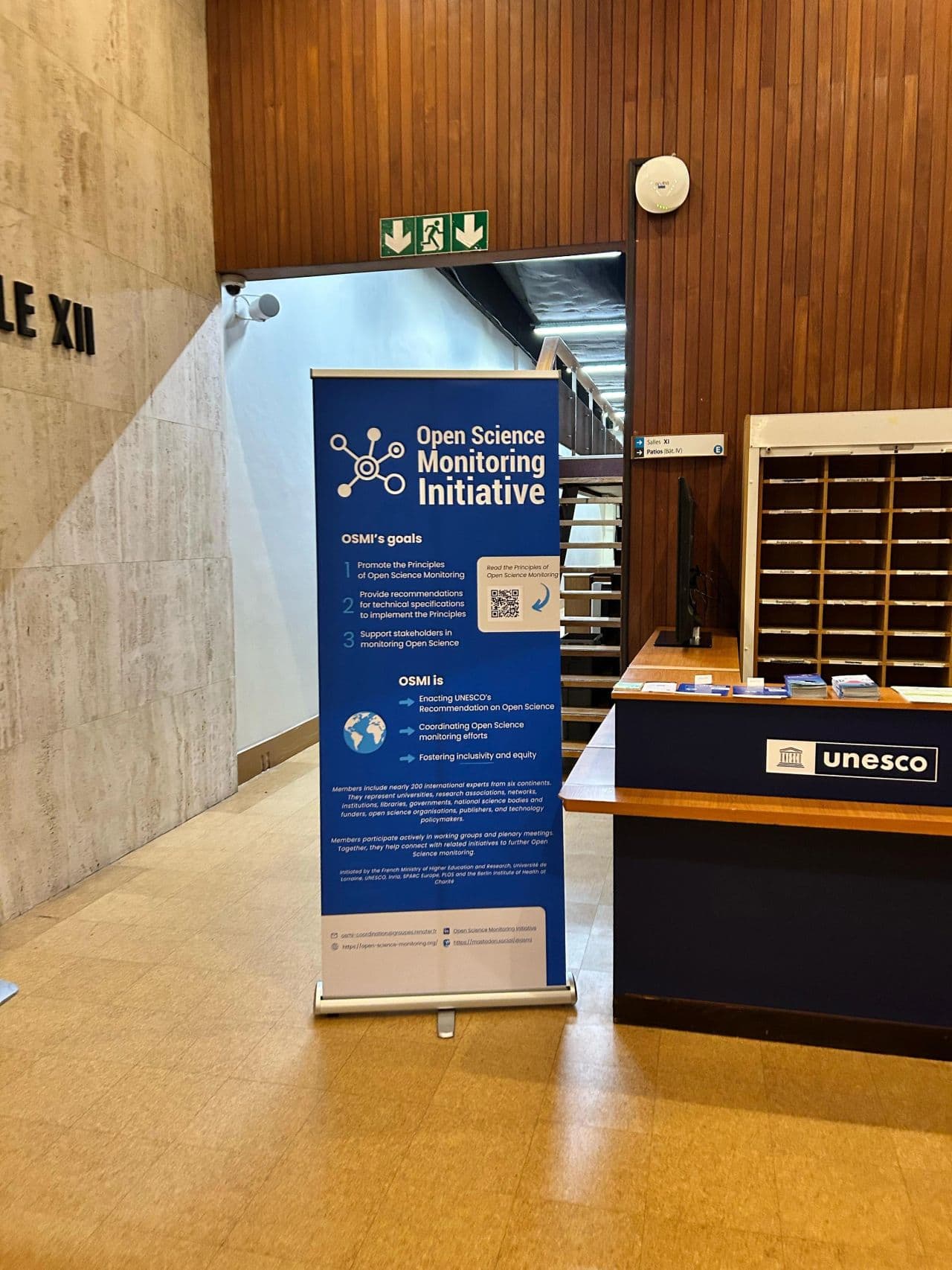 Open Science Monitoring Initiative banner beside the UNESCO reception desk